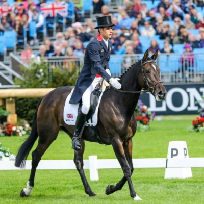 Image showing Overlander brand ambassador Wills Oakden riding a horse during a dressage event